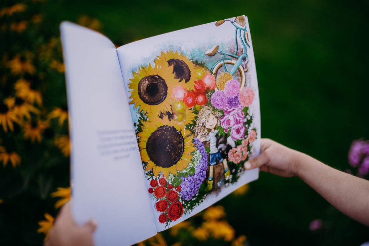 Open page of Bo's Bike of Blooms showing a colourful illustrated bouquet with sunflowers